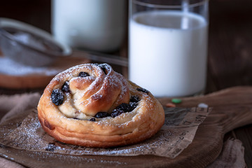 Kraffins with raisins and dried apricots, sprinkled with powdered sugar on top. Festive mood.