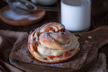 Kraffins with raisins and dried apricots, sprinkled with powdered sugar on top. Festive mood.