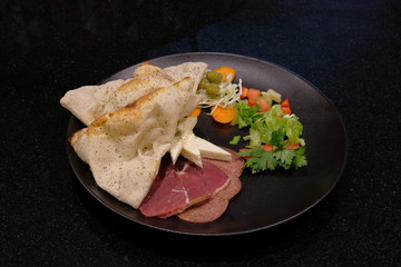 Food on a black background. Restaurant food.