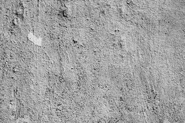Texture of a concrete wall with cracks and scratches which can be used as a background