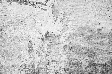 Texture of a concrete wall with cracks and scratches which can be used as a background