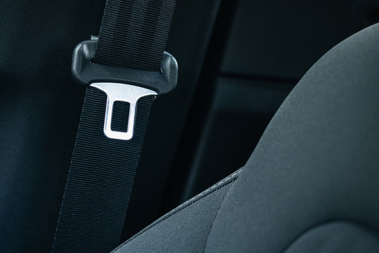 seat belt in a car interior close-up. The concept of life insurance and safe driving.