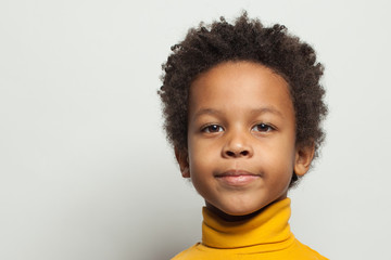 Portrait of cute black child boy on white background © millaf (Nemchinova)
