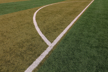 Obraz premium White lines on the green plastic playground