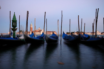Fototapeta na wymiar Long exposure view of gondolas and San Giorgio Maggiore across the Grand Canal, Venice, Italy