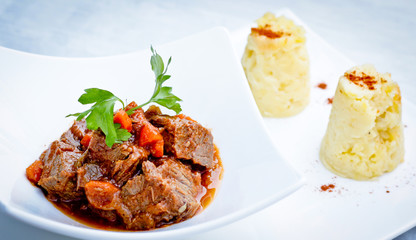 Steamed beef with carrots and  smashed potatoes