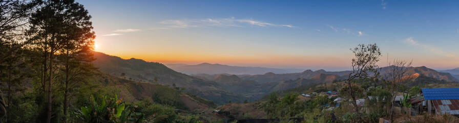 In the morning, a small village on a valley in the north of Thailand.