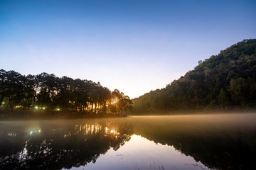 Obraz premium Morning light at Pang Ung (Pang Tong reservoir) in the mist at sunrise, Mae Hong Son province, Thailand,forest background. Concept Travel