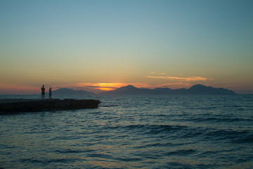 Kos island. Sunset on the background of mountains.