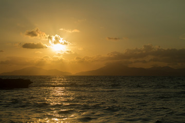 Kos island. Sunset on the background of mountains.