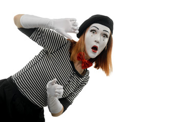 Portrait of female mime artist on white