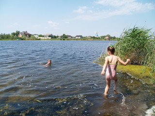children bathe in the river