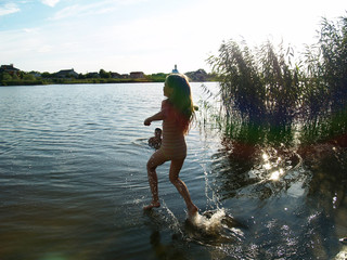 children bathe in the river