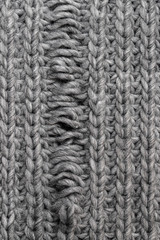 Light grey knitting texture with manufacturing defect isolated on white