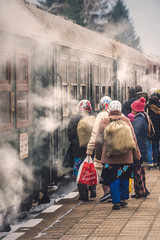 VELINGRAD, BULGARIA - FEBRUARY 8, 2020: BDZ narrow gauge train and people at the railway station in...