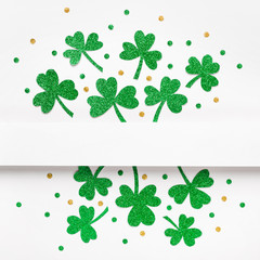 Happy St. Patricks Day background. Green glitter shamrocks pattern background