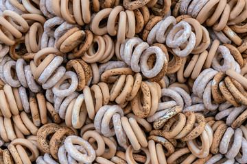 Crispy sweet bagels with poppy seeds. Food background of dried bagels. 