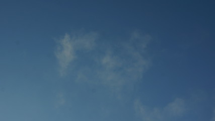 Obraz premium Cumulus and Cirrus clouds in a blue sky