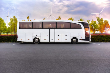 coach bus with electric traction on the background of windmills