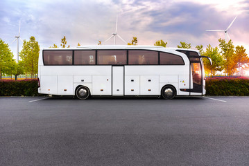 coach bus with electric traction on the background of windmills © Oleksandr