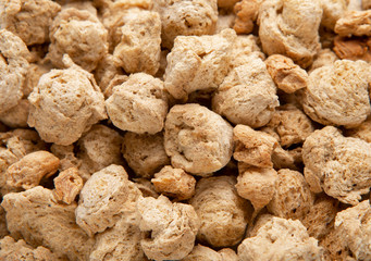 Background of dehydrated soy meat close up