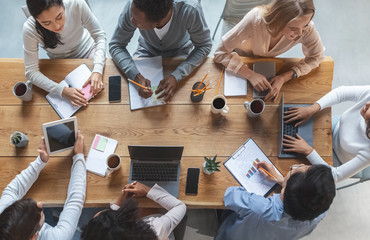 Multiracial business team having meeting, top view