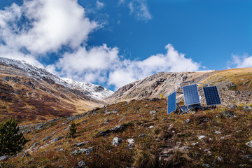 Solar panels on the hillside. Aktru Valley, Severo-Chuysky ridge, Altai Republic, Russia