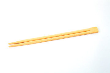 disposable chinese chopsticks on white background close-up