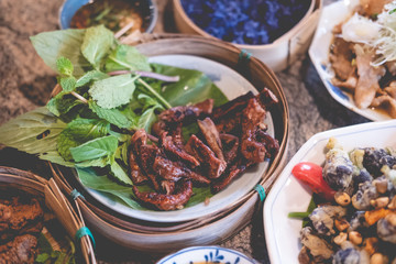 Fried pork fillet slice served with fresh vegetable.