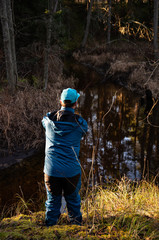 Fisherman angler  fishing forest river blue costume catch  trout