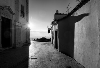 Dawn in the old city of Alfama. Lisbon. Portugal. Black and white.