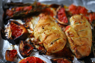 Baked chicken fillet with grapefruit and rosemary on a baking sheet. Keto, Paleo, Pegan, diet.