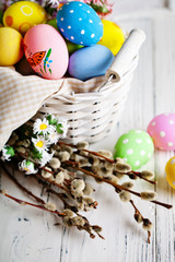 Happy Easter. Congratulatory easter background. Easter eggs and flowers. Background with copy space. Selective focus.