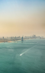 Aerial view of Dubai coast and Marina Skyline at sunset 