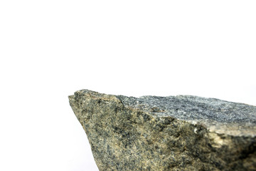 Cliff concept. Corner or face of a stone on an isolated white background with perspective.