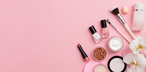 Beauty background with facial cosmetic products. Makeup, skin care concept.