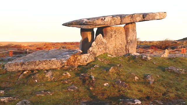 Left to right slow panning motion of the Poulnabrone Dolmen, this ancient Portal Tomb was constructed from great slabs of limestone over 5000 years ago, ancient burial site in County Clare,Ireland
