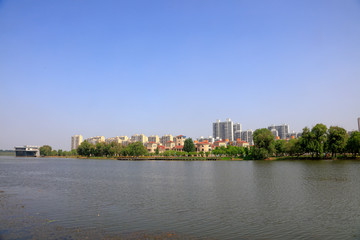 Fototapeta na wymiar Waterfront city building scenery, China
