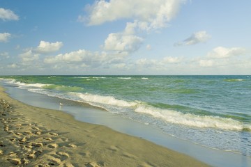 Amazing view of turquoise water of Atlantic ocean and blue sky with white clouds. Miami Beach....