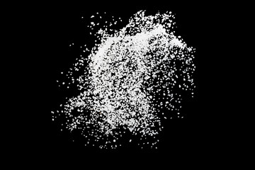 Sea salt explosion isolated on black background close up