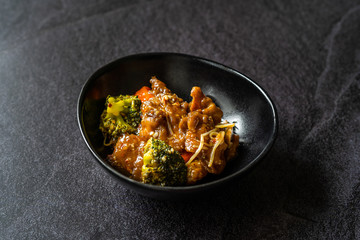 Shanghai Style Sea Bass Fish Fillets Food with Vegetables, Soy Sprouts and Broccoli.
