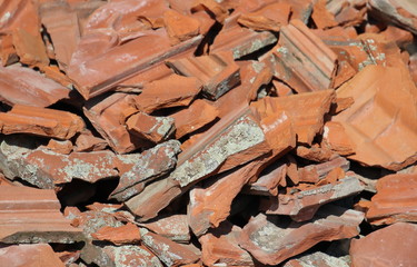 Broken brick and tile, detail construction and demolition debris at construction site background and texture