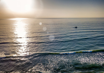 Fototapeta na wymiar Aerial view of sunset over the sea photos taken by the drone