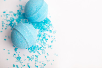 Bath bombs on a white background. blue bath bombs and sea salt on a white table, background with...
