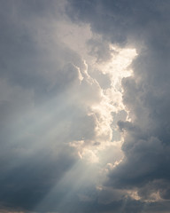 Obraz premium Sunbeam between storm clouds cloudscape sky