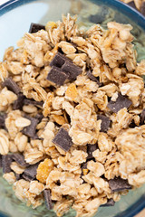 Cereal bowl with wooden spoon on craft board