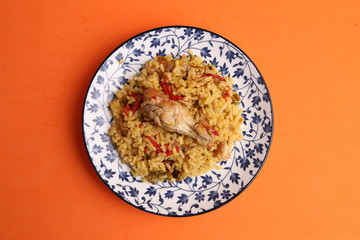 plate of rice with chicken and peppers