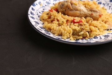 plate of rice with chicken and peppers