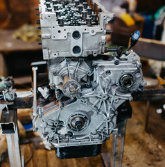 car in-line engine repair, disassembled motor.