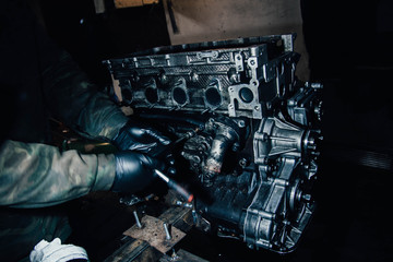 car in-line engine repair, disassembled motor.